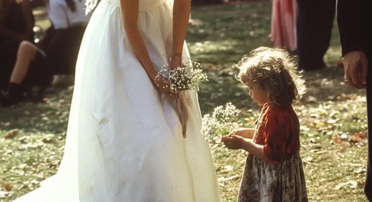 At My Wedding, a Little Girl with a Bouquet of Daisies Asked for a Coin – I Glanced at Her Hand & Stopped the Wedding